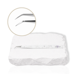 45-degree angled lash isolation tweezer with white marble-pattern handle showing a close-up of the fine precision tip on a white background.