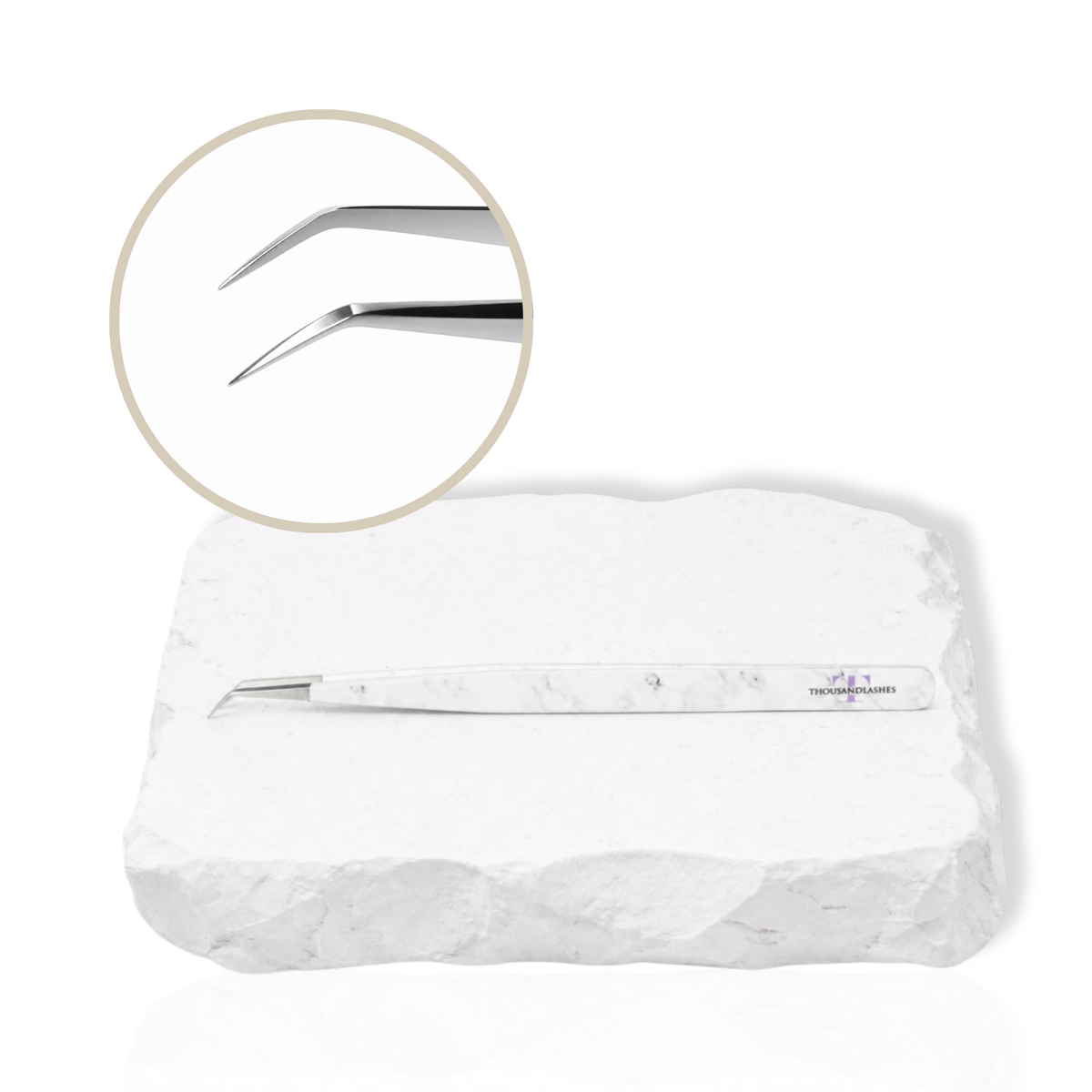 45-degree angled lash isolation tweezer with white marble-pattern handle showing a close-up of the fine precision tip on a white background.