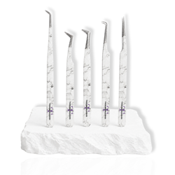 Beginner's Eyelash Tweezers Kit featuring five white marble-pattern lash tweezers with different angled tips displayed on a white stone surface.