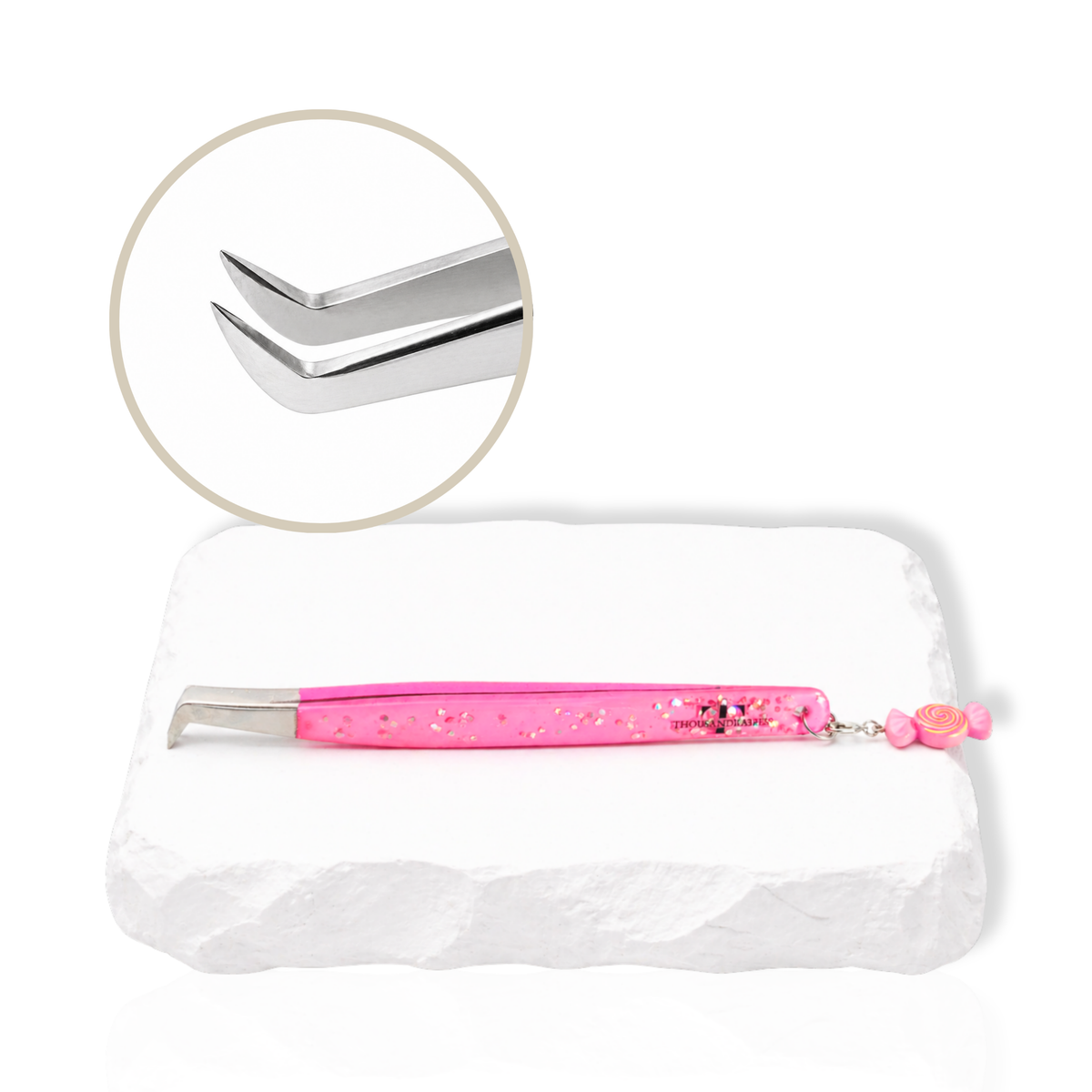Candy Charm lash tweezer close-up showing curved tip design for lash extension techniques.