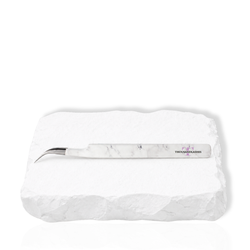 Dolphin curved lash tweezer side view showing the white marble finish and angled head design