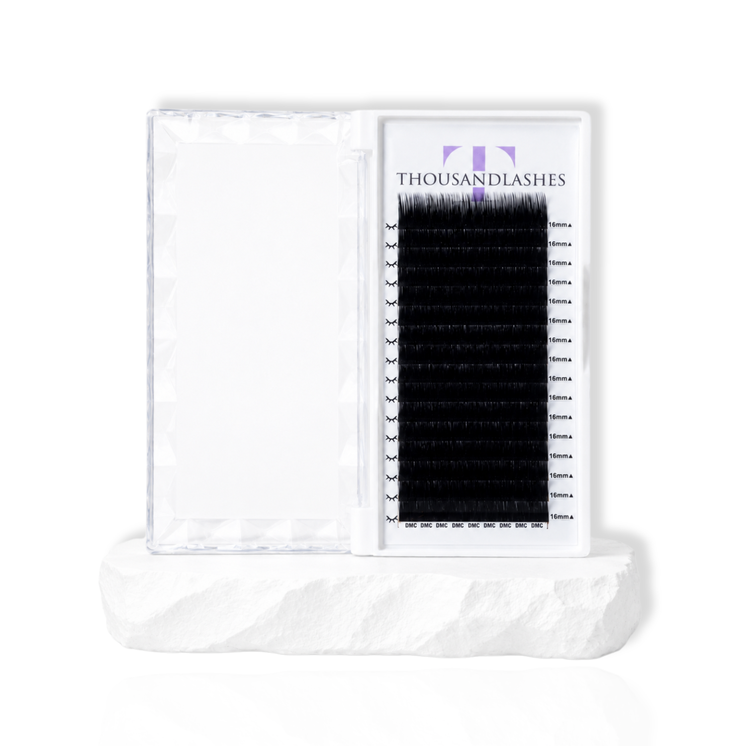 Close-up eye showing a classic flat lash extension set with dark matte black lashes and textured lash styling