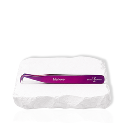 Marlowe purple angled lash tweezer displayed on a white stone surface