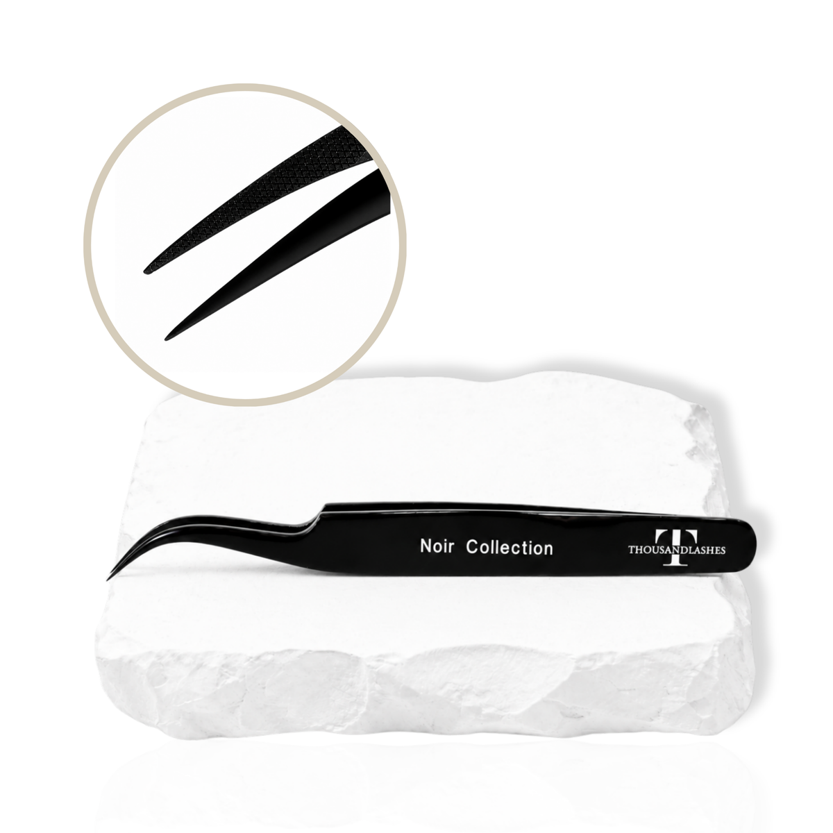 Noir Collection black lash tweezer displayed on a white stone surface with close-up of fine tweezer tips.