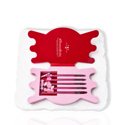 Pink Candy Charm Collection tweezer set displayed inside a candy-shaped storage case 