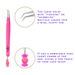 Pink Candy Charm lash tweezer displayed on a white stone surface with close-up of curved tweezer tip and removable candy charm.