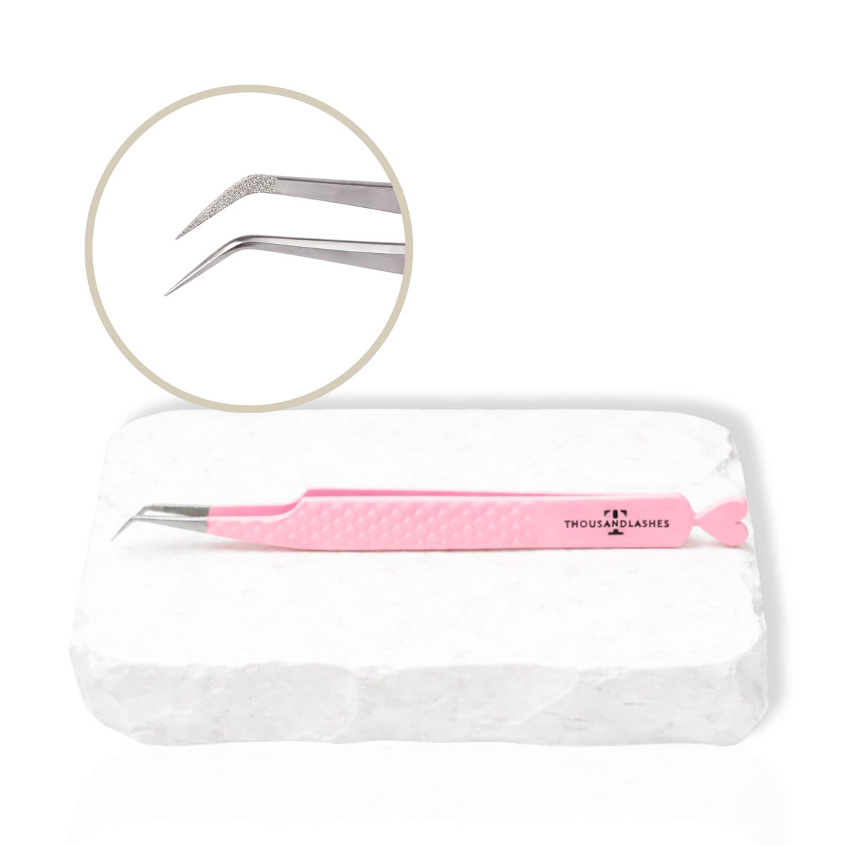 Pink Thousandlashes 45-degree isolation tweezer with close-up view of the angled tip on a white stone surface.
