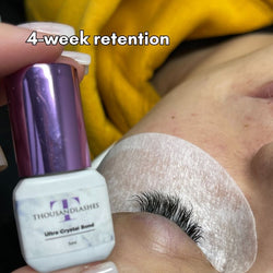 ThousandLashes Ultra Crystal Bond eyelash adhesive showing 4-week lash extension retention result during professional lash application