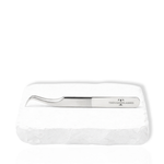 Thousandlashes M Narrow silver lash tweezer on a white stone surface.