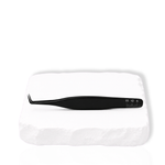 Thousandlashes Noir Collection 90-degree tweezer on a white stone surface.