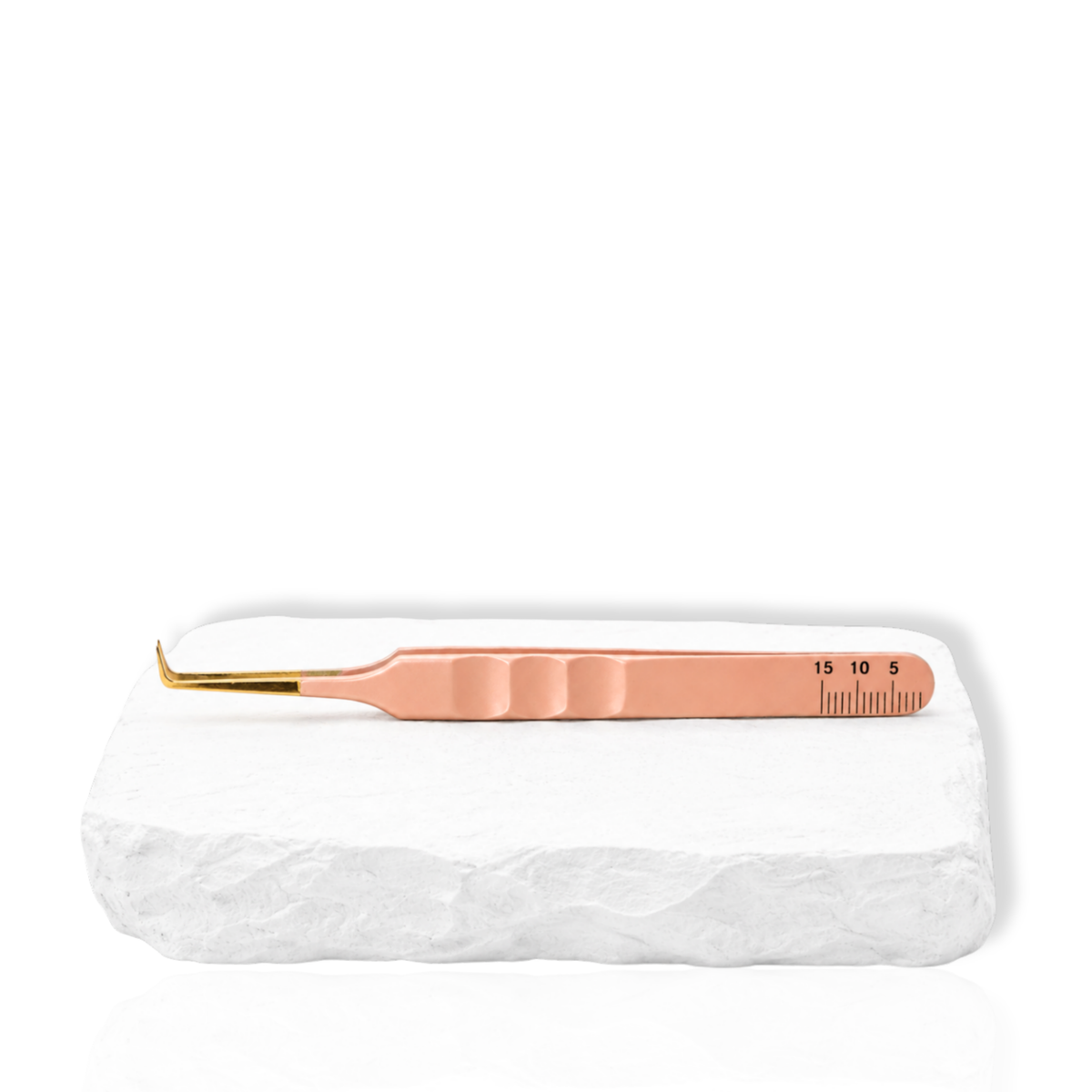 Thousandlashes nude 90-degree tweezer shown from the reverse side on a white stone surface.
