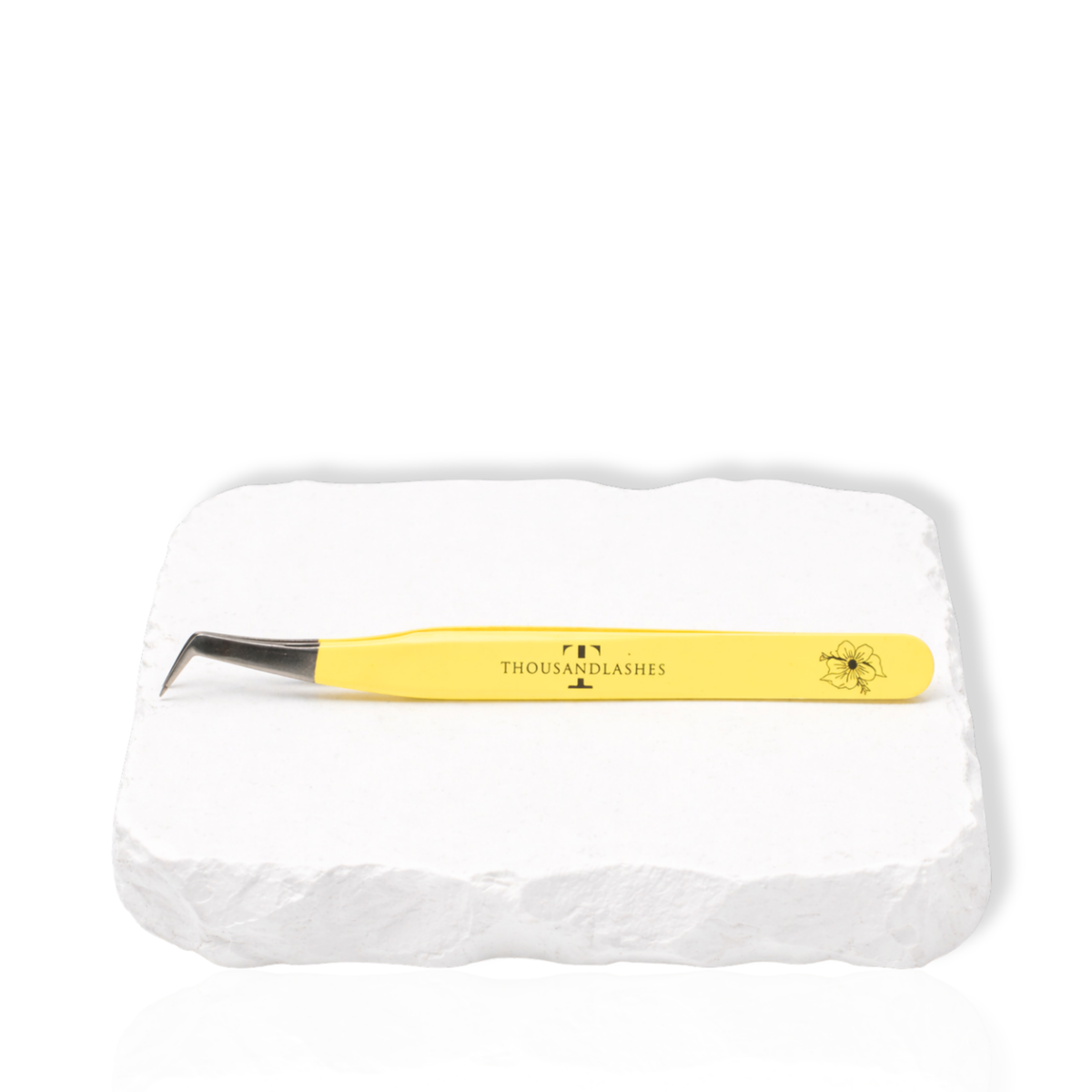 Thousandlashes yellow Summer Spring Collection angled lash tweezer on a white stone surface.