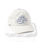 thousandlashes Lash Artist Cap with “Creating Lash Magic” embroidery, shown at a slight angle.