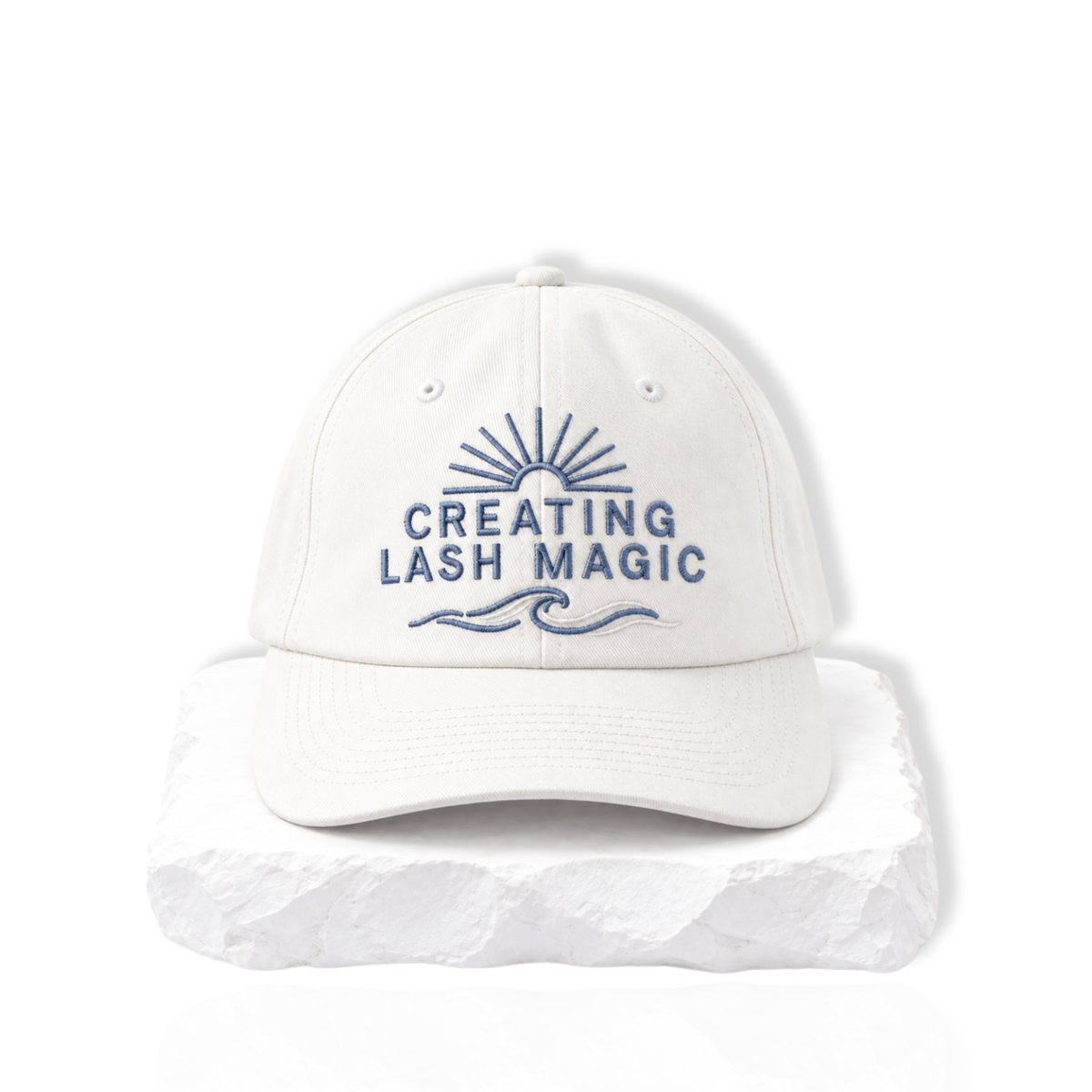 thousandlashes Lash Artist Cap with “Creating Lash Magic” embroidery, shown from the front.