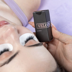 Lash artist holding Velour product during lash extension service
Professional lash artist using ThousandLashes Velour Lash Adhesive for eyelash extension application and long retention